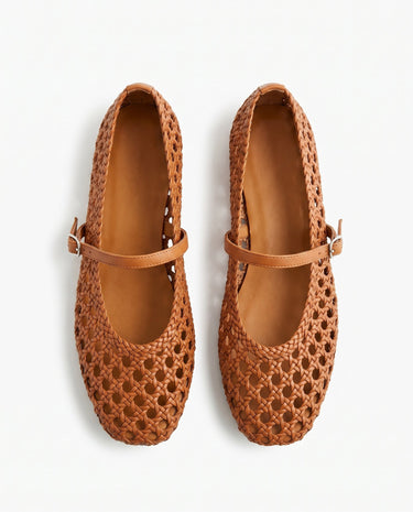 The Wren Mary Janes in camel — woven square-toe flats with buckle strap, top-down pair view