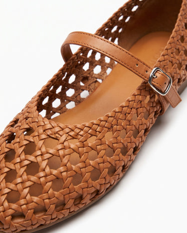 The Wren Mary Janes in camel — close-up of woven upper and buckle strap detail