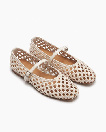 The Wren Mary Janes in white — woven square-toe flats with buckle strap, angled pair view