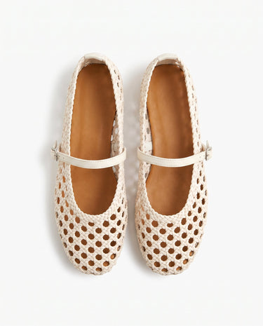 The Wren Mary Janes in white — woven square-toe flats with buckle strap, top-down pair view