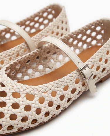 The Wren Mary Janes in white — close-up of woven upper and buckle strap detail