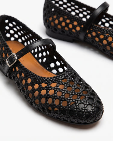 The Wren Mary Janes in black — close-up of woven cutout upper and buckle strap detail