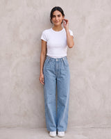 The Tiela Adjustable Jeans in blue — wide-leg jeans, front view on model