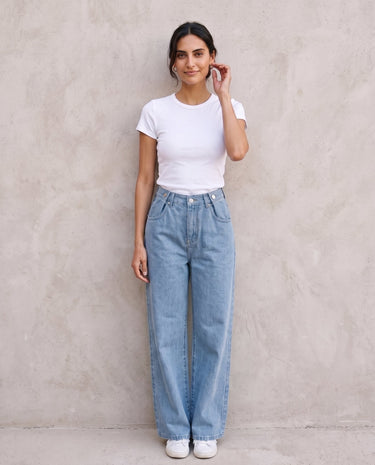 The Tiela Adjustable Jeans in blue — wide-leg jeans, front view on model