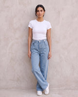 The Tiela Adjustable Jeans in blue — wide-leg jeans, full-length front view on model