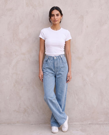 The Tiela Adjustable Jeans in blue — wide-leg jeans, full-length front view on model