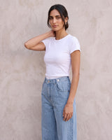 The Tiela Adjustable Jeans in blue — wide-leg jeans, side view on model
