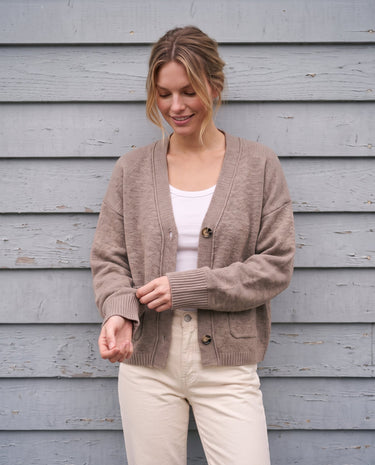 The Vintage Rosabele Cardigan in brown — knit cardigan, front view buttoning on model