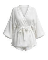 White Seaside Amalfi Set — wrap-front tie-waist top with blouson sleeves and matching shorts, flat-lay