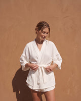 White Seaside Amalfi Set in white — full front view on model against a sunlit terracotta wall