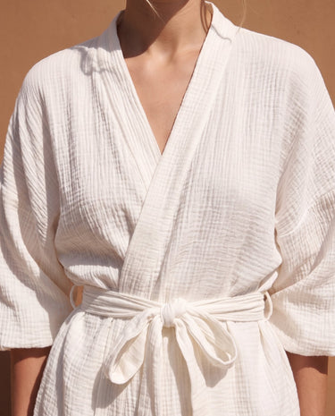 White Seaside Amalfi Set in white — close-up of the wrap front, V neckline and self-tie belt