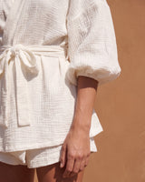 White Seaside Amalfi Set in white — detail of the crinkle-texture fabric, tie belt and gathered cuff