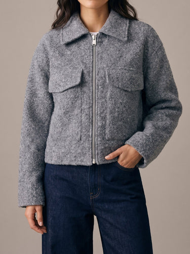 Zoe Coat in gray — three-quarter front view on model showing the flap chest pockets