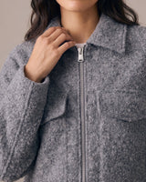 Zoe Coat in gray — close-up on model showing the collar and zip front